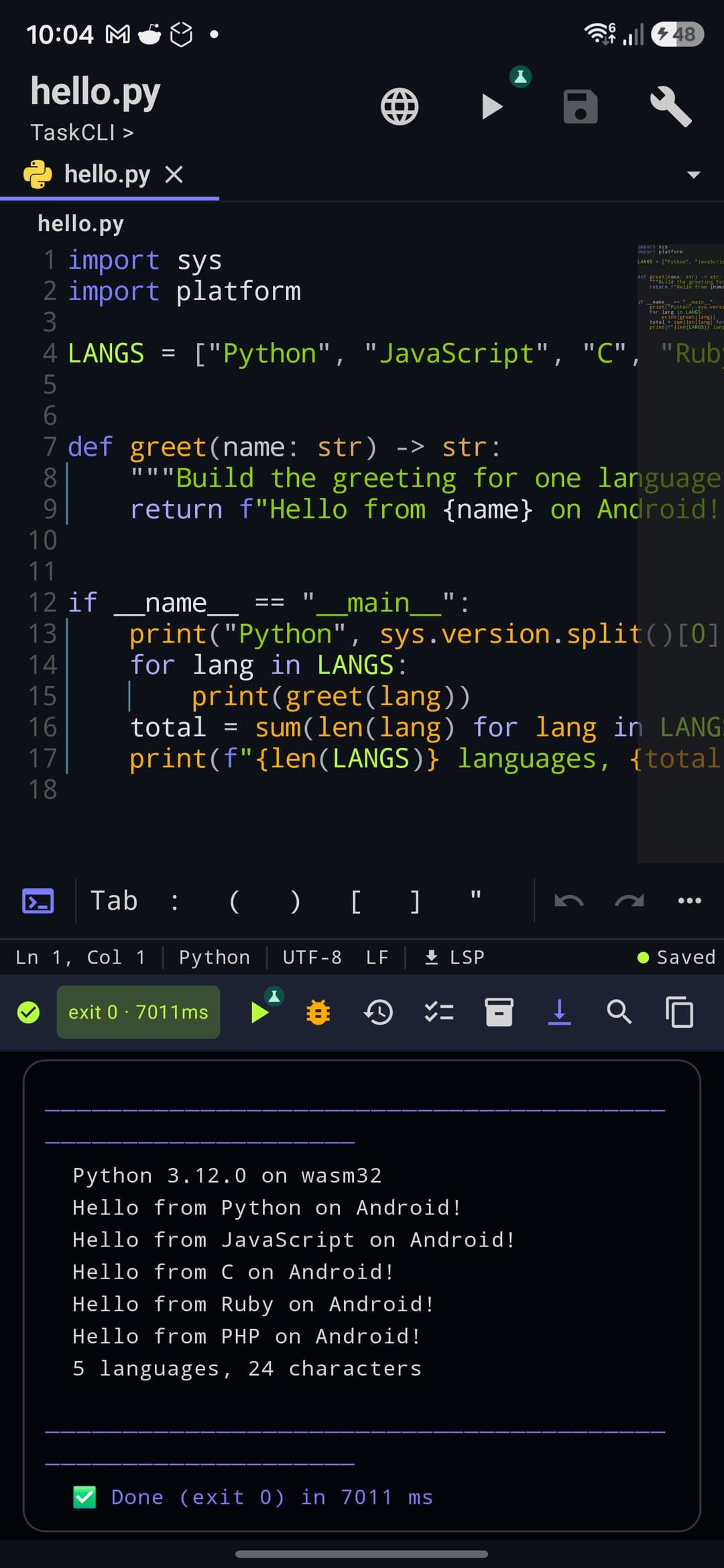 Full-screen editor on a phone with hello.py open: top bar, tab, Python code, symbol bar, status bar and the Run panel showing the output and exit 0